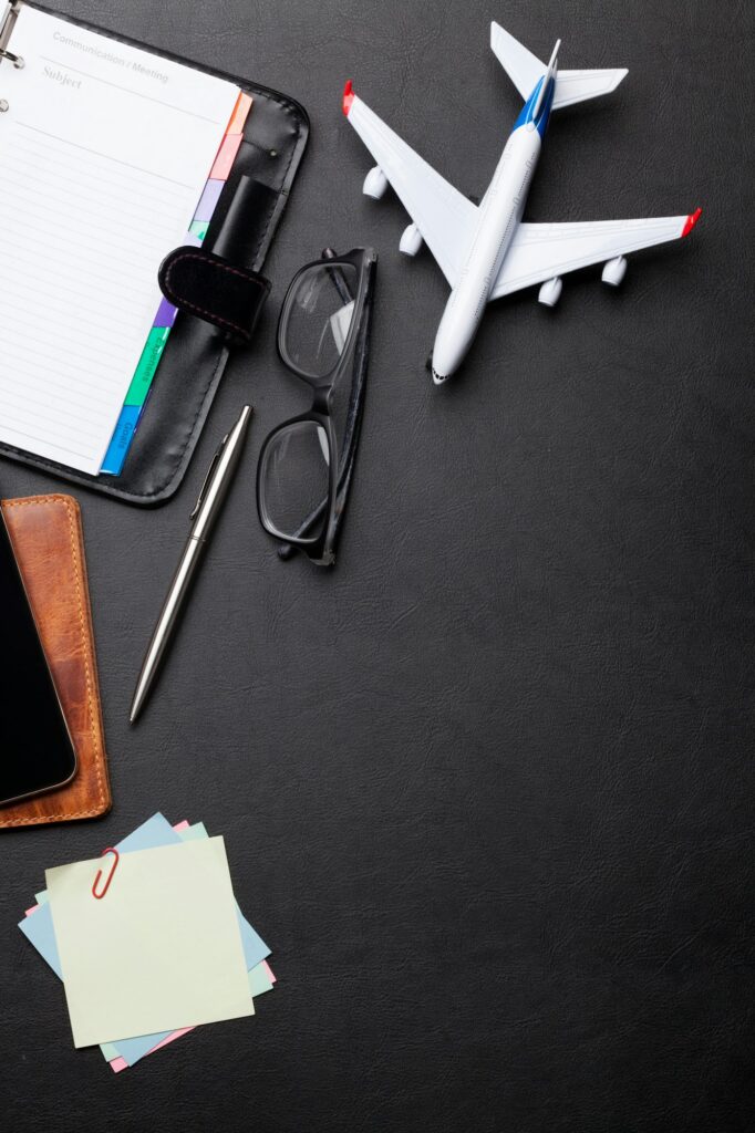 Business trip concept. Accessories on desk table