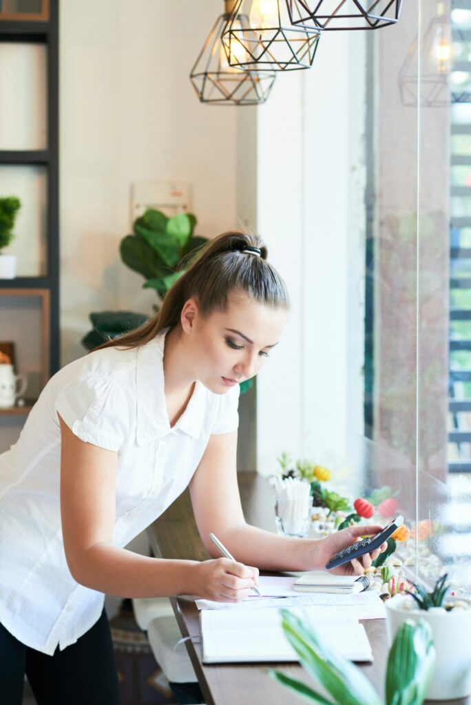 Young woman managing coffee shop business